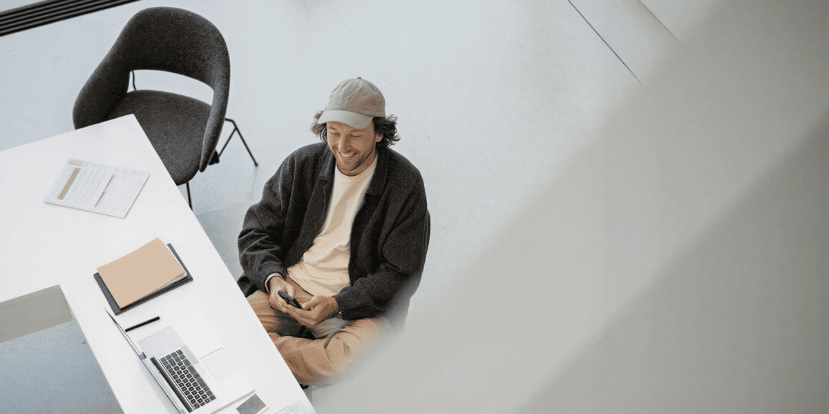 Man at Desk with Devices